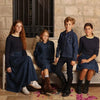 Baby in a colorful embroidery denim coordinated set, artistic matching sibling outfit for special family occasions.