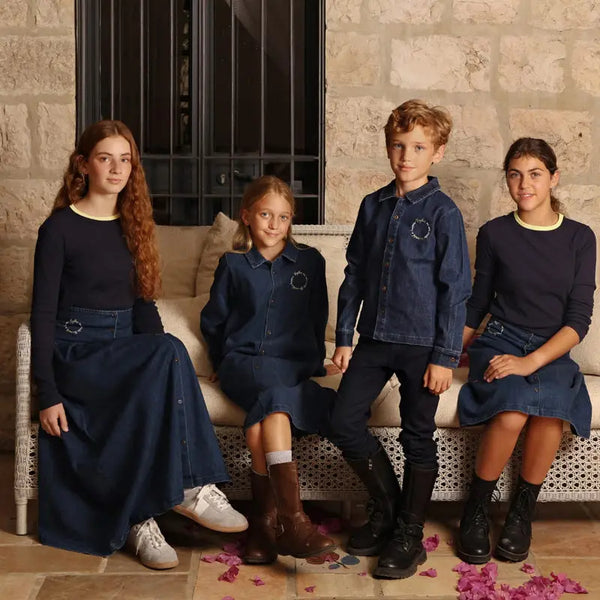 Baby in a colorful embroidery denim coordinated set, artistic matching sibling outfit for special family occasions.