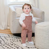 Little one wearing a corduroy Shabbos set, elegant matching sibling outfit for traditional family celebrations.