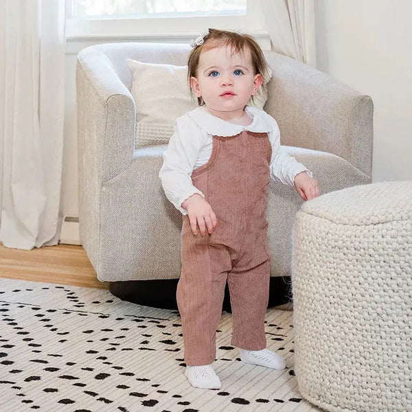 Little one wearing a corduroy Shabbos set, elegant matching sibling outfit for traditional family celebrations.