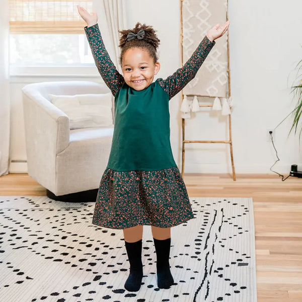 Little lady wearing a waffle patch textured set, warm matching sister style for chilly family days.