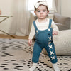 Little one dressed in a drawstring coordinated set, comfortable matching sibling style for relaxed family moments.