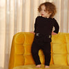 Baby in a floral embroidered packet coordinated set, intricate matching sibling outfit for special family celebrations.