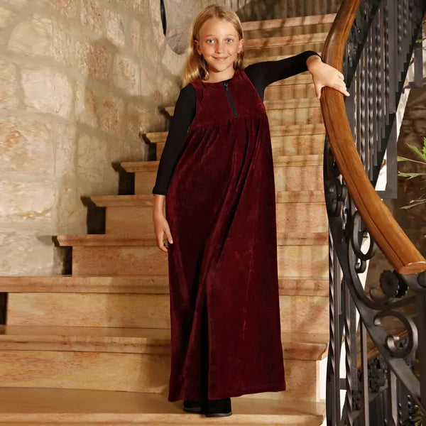 Little lady wearing a burgundy red chenille soft set, warm matching sister outfit for cozy family gatherings.