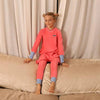 Little one in a mail logo blue and pink velvet strip set, colorful matching sibling outfit for fun family occasions.