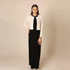 Woman dressed in a modest cotton modal cropped cardigan maxi set, elegant fashion for refined occasions.
