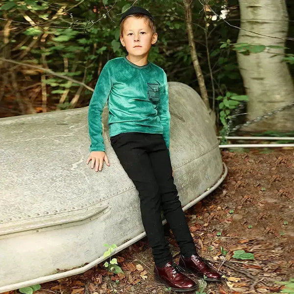Young boy in the overlay edit layered set, trendy matching brother style for contemporary family looks.