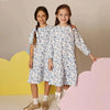 Little lady wearing a blue bloom Shabbos set, elegant matching sister outfit for special Shabbat dinners.