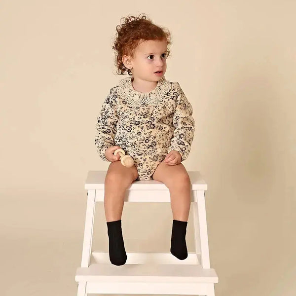 Adorable baby in a rich corduroy Shabbos set, elegant matching sibling outfit for traditional Shabbat gatherings.