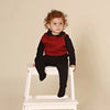 Adorable baby wearing a quilted Shabbos lounge set, cozy matching sibling outfit for relaxed Shabbat at home.