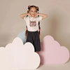 Young girl in a purrfectly chill kitten print set, adorable matching sister outfit for playful family fun.