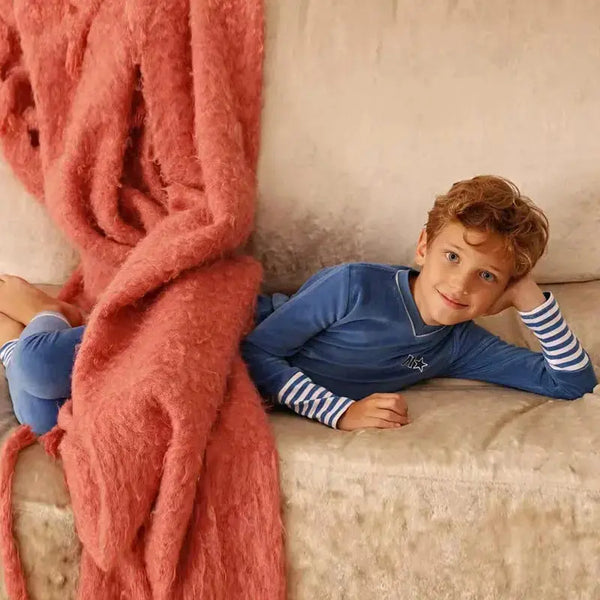 Young boy in a mail logo blue pink velvet set, colorful matching brother style for fun family gatherings.