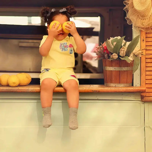 Toddler in a cute APPs icon print coordinated outfit, adorable matching sibling style for family photos.