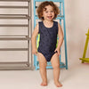 Toddler in a sunglasses print fun set, cool matching sibling outfit for stylish family outings.