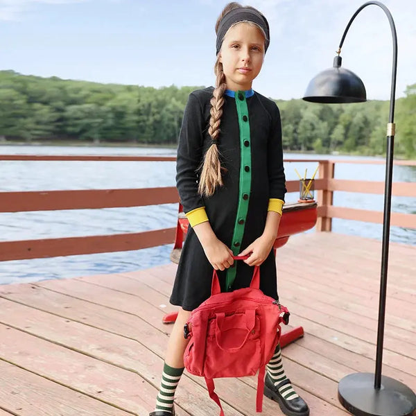 Little lady in a colorpop chic waffle set, modern matching sister outfit for trendy family looks.