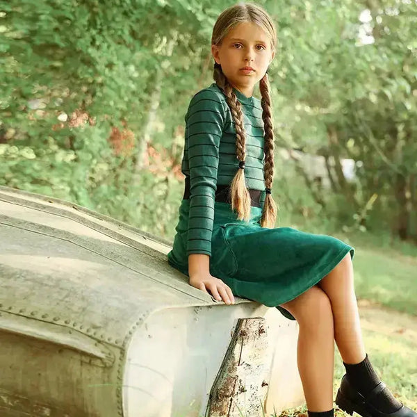 Little lady in the overlay edit layered set, trendy matching sister outfit for contemporary family looks.