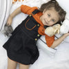 Young girl wearing a black denim classic set, stylish matching sister outfit for casual family outings.
