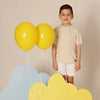 Young boy wearing a ribbed sunshine bow set, cheerful matching brother style for bright family celebrations.