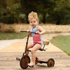 Little one in a pink and white contrast denim set, sweet matching sibling outfit for lovely family photos.