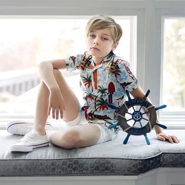 Little gentleman dressed in a boat print and red denim set, stylish matching brother outfit for fun outings.
