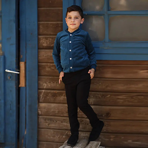 Boy wearing black Go-To Shabbos Pants in heavyweight stretch Ponte di Roma