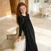 Little lady wearing an elegant black beaded strap maxi pinafore dress, modest matching sister style for special occasions.